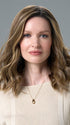 Model is wearing COREY by ENVY in HONEY BREEZE | A blend of Cool, Honey Blonde and Multi-Dimensional Medium Brown with Darker Brown Roots