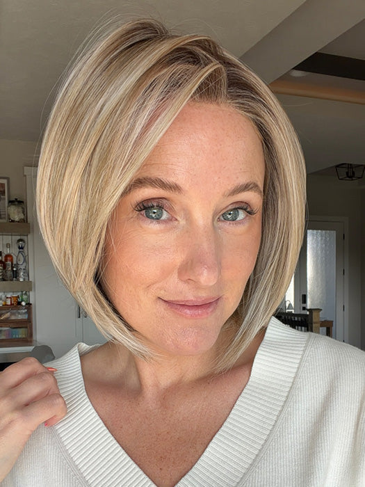 Carly N. @carlynwilson84 is wearing DION by BELLE TRESS in color BUTTERCAKE BLONDE-R | A neutral-warm blonde blend featuring light brown, ash, and lightest blonde tones with natural-looking darker roots for added depth and realism.