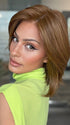 Model is wearing FARREN by AMORE in color BROWN-TOPAZ | Medium brown and light honey brown are carefully blended to create this warm-toned brunette shade. 