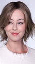 Model is wearing FERRARI By BELLETRESS in color SUNKISSED ALMOND R | A blend of Medium and Light Brown with Light Gold Blonde Highlights and a hint of Cooler Blonde, rooted with Medium and Light Brown