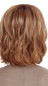 Model is wearing FLAWLESS WAVES by TRESSALLURE in color EL12/22/8 | Light Golden Brown Evenly Blended with Platinum Blonde Highlights with Medium Brown Roots