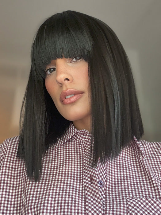 Model is wearing FRINGE EFFECT by HAIRDO in color R2 EBONY | Black