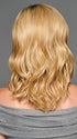 Model is wearing RAISE THE BAR in color GF14-22SS SS WHEAT| Dark Blonde Evenly Blended with Platinum Blonde with Dark Roots