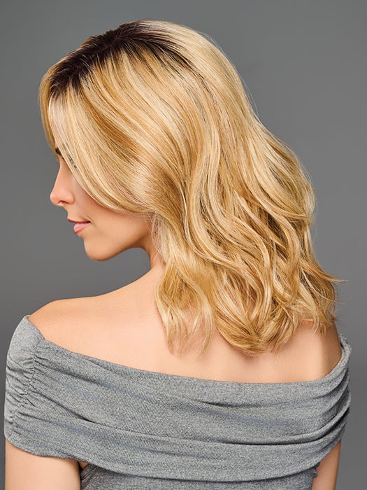 Model is wearing RAISE THE BAR in color GF14-22SS SS WHEAT| Dark Blonde Evenly Blended with Platinum Blonde with Dark Roots