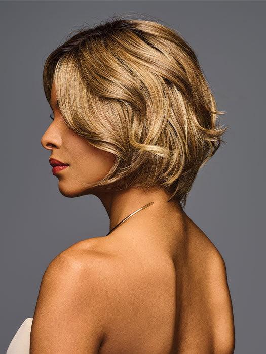Model is wearing TREND ALERT LUXURY in color GF11-25 SS HONEY PECAN | Chestnut Brown base blends into multi-dimensional tones of Brown and Golden Blonde