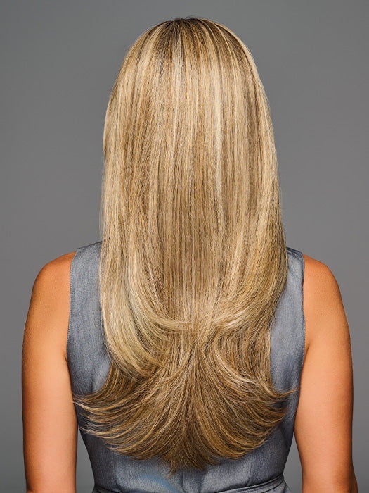 Model is wearing STAY OUT LATE in color GF12-22SS SS CAPPUCCINO | A radiant blend of warm blonde tones with sunlit highlights and soft dimension