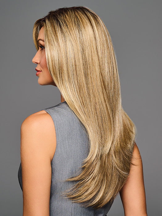 Model is wearing STAY OUT LATE in color GF12-22SS SS CAPPUCCINO | A radiant blend of warm blonde tones with sunlit highlights and soft dimension