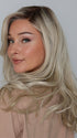 Heather @cjswigs wearing GLAM WAVEZ by RENE OF PARIS in color MILKY OPAL R | A Blend of Creamy Blonde and White Blonde Rooted with Warm Brown