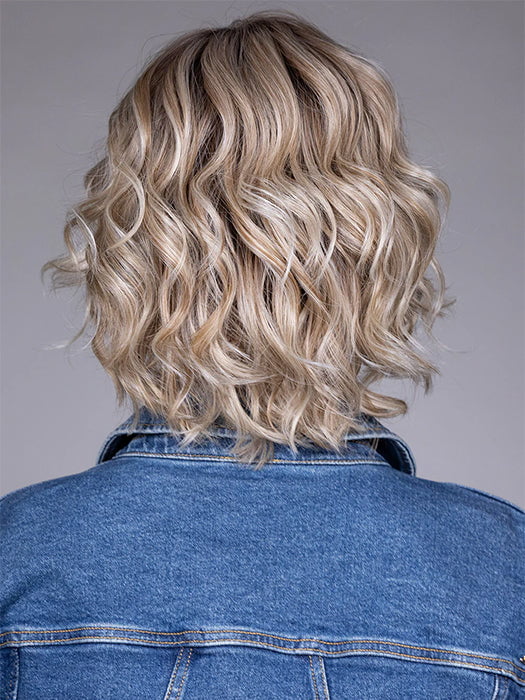 Model is wearing HOUSTON in color MILKSHAKE BLONDE R | A mixture of Light Sandy Brown, Highlighted with Light Ash Blonde with a Hint of Light Platinum Blonde with a Medium Root Color
