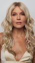 Model is wearing HANA by NORIKO in color Light Ash Blond R | Cream Ash Blonde with ash brown and white-grey roots that blend into a variety of ash blonde tones, including ash pearl blonde, creamy ivory, and pale cream
