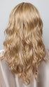 Model is wearing HANA by NORIKO in color Light Ash Blond R | Cream Ash Blonde with ash brown and white-grey roots that blend into a variety of ash blonde tones, including ash pearl blonde, creamy ivory, and pale cream