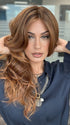 Model is wearing HANA by NORIKO in color Venetian Red R | A beautiful red shade that mixes pale copper, soft mahogany, and warm burnt-toffee cherry tones. The rich chestnut roots add dimension and depth. 
