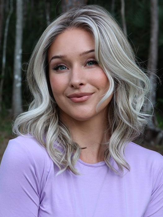 Heather @cjswigs wearing LAGUNA BEACH by BELLE TRESS in color MILKSHAKE BLONDE R | A mixture of Light Sandy Brown, Highlighted with Light Ash Blonde with a Hint of Light Platinum Blonde with a Medium Root Color