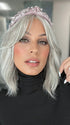 Roxie is wearing HOLLIE PETITE by JON RENAU in shade 56F51 OYSTER | Light Grey with 20% Medium Brown Front, graduating to Grey with 30% Medium Brown Nape (headband not included)