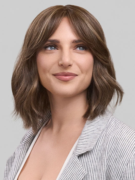 Model is wearing HOLLIE PETITE by JON RENAU in color 8RH14 MOUSSE CAKE | Medium Brown with 33% Medium Natural Blonde Highlights