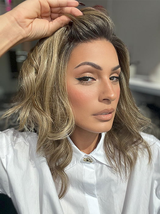 Model is wearing COREY by ENVY in color HONEY BREEZE | A blend of Cool, Honey Blonde and Multi-Dimensional Medium Brown with Darker Brown Roots