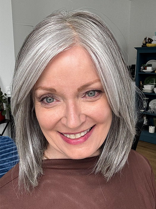Mel B. @mels.be.ageless wearing ILA by RENE OF PARIS in color SILVER-STONE | Silver Medium Brown blend that transitions to more Silver then Medium Brown then to Silver Bangs