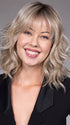 Model is wearing JIL in BUTTERBEER R | Dark Brown Base and Root that transitions smoothly into a buttery blonde, infused with creamy honey and toffee tones