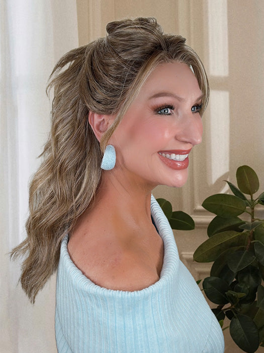 Kim Hammon @letstalkwithkim wearing KELLY by BELLE TRESS in color BROWN SUGAR BLONDE-R | A warm, dimensional blend of medium brown and golden blonde highlights with natural-looking darker roots for depth and a sun-kissed finish. (styled into ponytail) 