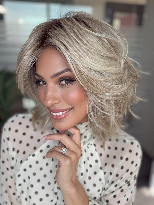 Model is wearing LORYN in color SEA SALT BLOND R | A perfect mixture of cool, icy-blond and warm-dark blond. The rich brown root tone enhances the modern appearance