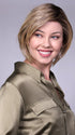 Model is wearing MANCHESTER in RAW SUGAR BLONDE | A Neutral Light Blonde, Honey Blonde, Pale Gold Blonde, with a base of Light Brown Low Lights featuring a Medium Root Color