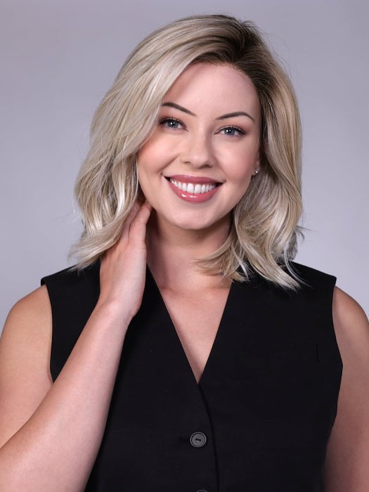 Model is wearing MANHATTAN by BELLETRESS in color CRUSHED-ALMOND-BLONDE-R | A soft Neutral Light Blonde with a Light and Medium Blended Root Color