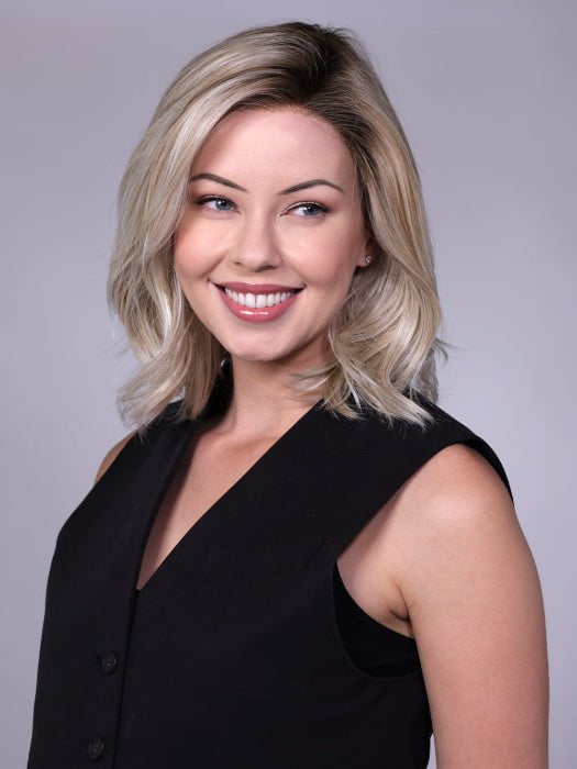 Model is wearing MANHATTAN by BELLETRESS in color CRUSHED-ALMOND-BLONDE-R | A soft Neutral Light Blonde with a Light and Medium Blended Root Color