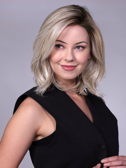 Model is wearing MANHATTAN by BELLETRESS in color CRUSHED-ALMOND-BLONDE-R | A soft Neutral Light Blonde with a Light and Medium Blended Root Color