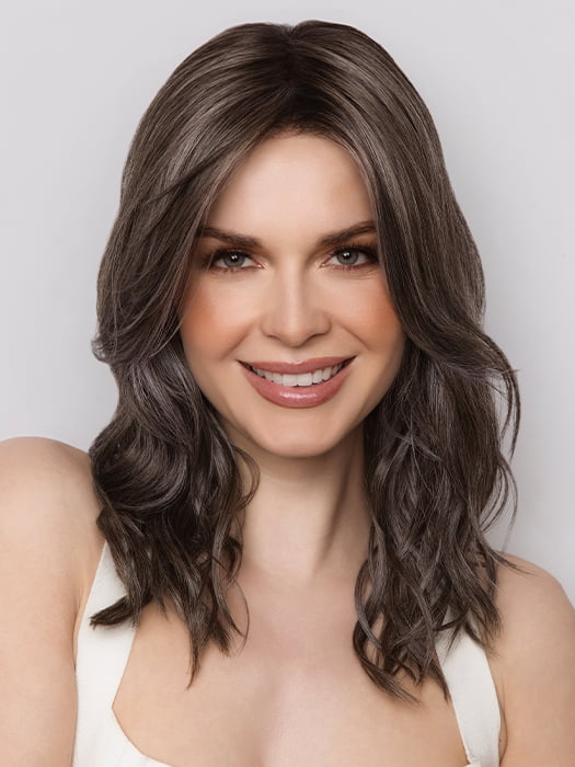 Model is wearing MAUDE by Amore in color MUSHROOM-GREY-R | Dark brown incorporates light brown and silvery grey tones with shadow roots for a stylish finish.