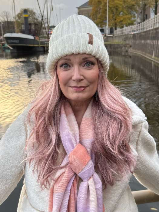 Mel B. @mels.be.ageless wears WREN by RENE OF PARIS in color WATERMELON-R | Rich Pastel Pink Base with Subtle Soft Reddish Tone and Soft Dark Brown Roots