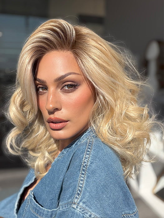 Roxie is wearing the MILLION DOLLAR BABE by TRESSALLURE in color 24/102/R12 | Gold Blonde with Platinum highlights with Gold Brown roots