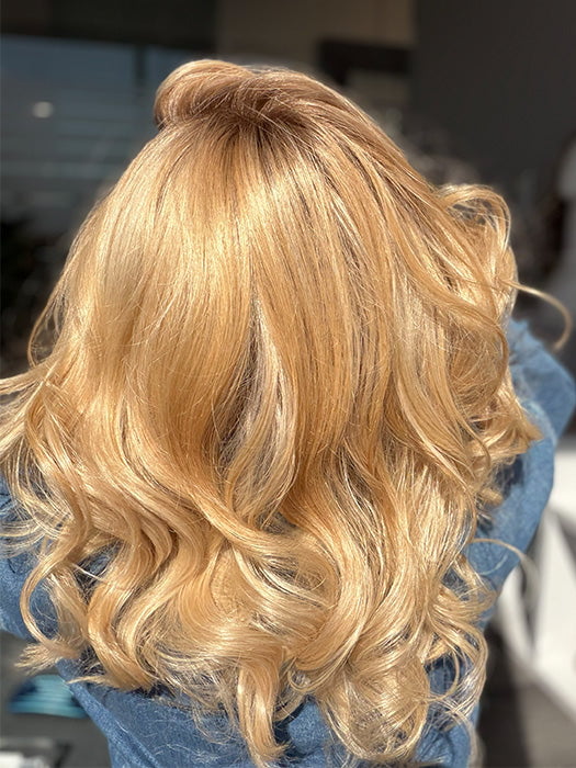 Roxie is wearing the MILLION DOLLAR BABE by TRESSALLURE in color 24/102/R12 | Gold Blonde with Platinum highlights with Gold Brown roots