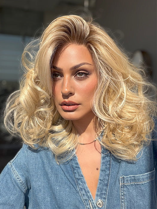 Roxie is wearing the MILLION DOLLAR BABE by TRESSALLURE in color 24/102/R12 | Gold Blonde with Platinum highlights with Gold Brown roots