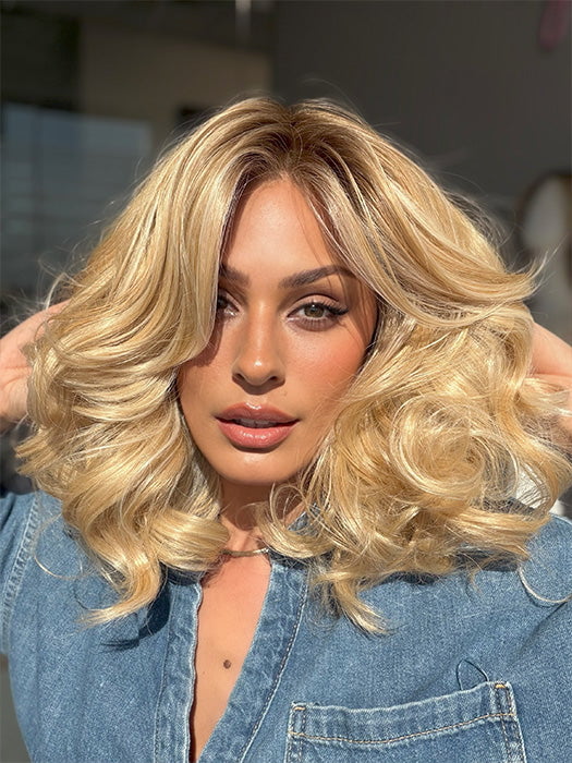 Roxie is wearing the MILLION DOLLAR BABE by TRESSALLURE in color 24/102/R12 | Gold Blonde with Platinum highlights with Gold Brown roots