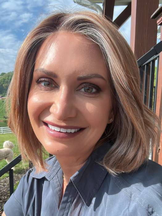 Emily H. @she_sheds_more wearing Mira by Amore in shade CINNAMON FROST R | Warm, medium coppery-brown base with white-blond highlights. The medium brown root color adds a realistic vibe.