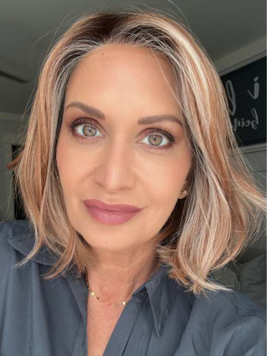 Emily H. @she_sheds_more wearing Mira by Amore in shade CINNAMON FROST R | Warm, medium coppery-brown base with white-blond highlights. The medium brown root color adds a realistic vibe.