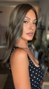 Roxie is wearing MORGAN BY JON RENAU in 8RH14 MOUSSE CAKE | Medium Brown with 33% Medium Natural Blonde Highlights