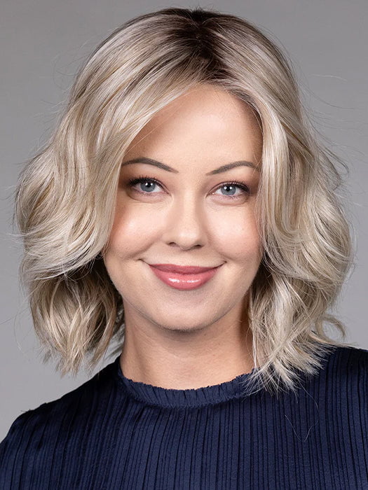 Model is wearing OLIVIA in color BUTTERBEER R | Dark Brown Base and Root that transitions smoothly into a buttery blonde, infused with creamy honey and toffee tones