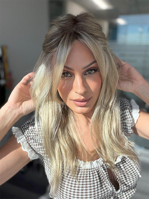 Model is wearing OLIVIA by JON RENAU in color 22F16S8 VENICE BLONDE | Light Ash Blonde and Light Natural Blonde Blend Shaded with Medium Brown (styled with clip - not included)