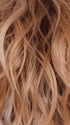 PEACHES-AND-CREAM | A vibrant peach blonde with creamy undertones and bright, face-framing cream highlights. Rich chocolate root adds depth.