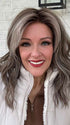 Marcie @wig.obsessed wearing BEACH WAVE MAGIC by TRESSALLURE in color 52/38/49/R8 | 3 Tones of Grey blended with Dark Brown Roots
