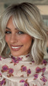 Roxie is wearing HOLLIE by JON RENAU in 101/88/27S8 CATALINA BLONDE | Pale blonde with Pure White Natural Violet halo highlights, shaded medium brown