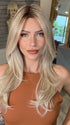 Madeline wearing SPEARS by BELLETRESS in MILKSHAKE BLONDE R | A mixture of Light Sandy Brown, Highlighted with Light Ash Blonde with a Hint of Light Platinum Blonde with a Medium Root Color