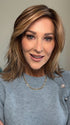 Eileen wearing FLOW by ELLEN WILLE in LIGHT BERNSTEIN ROOTED | Lightest Brown, Light Golden Blonde, and Dark Strawberry Blonde Blend with Shaded Roots