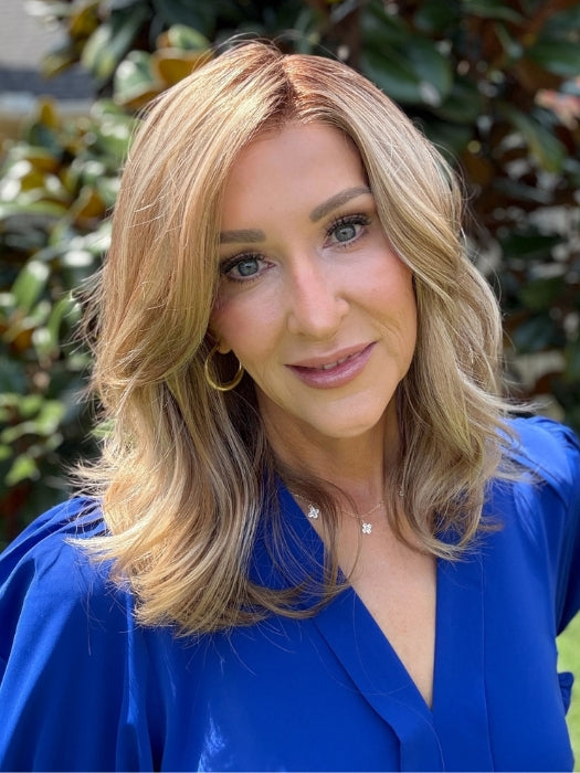 Eileen wearing AMANDA by ENVY in SPARKLING CHAMPAGNE | Medium Brown roots with overall Strawberry Blonde base and soft Golden Blonde highlights