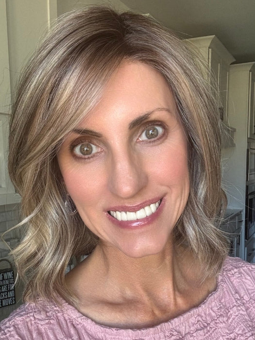 Lisa wearing BERRY by BELLETRESS in SPARKLING CHAMPAGNE BLONDE R | A radiant blend of champagne blonde with soft golden and beige tones, grounded by natural-looking roots in ash brown and dark blonde.