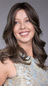 Model is wearing ROBERTS TRUFFLE CREAM-R  | in color A chocolate truffle-inspired medium brown base with creamy light blonde highlights and dark roots, creating a balanced, multidimensional brunette.