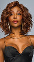 Model is wearing ROMANTIC RENAISSANCE in color RL32/31 CINNABAR | Medium Dark Auburn Evenly Blended with Medium Light Auburn
