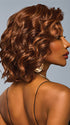 Model is wearing ROMANTIC RENAISSANCE in color RL32/31 CINNABAR | Medium Dark Auburn Evenly Blended with Medium Light Auburn