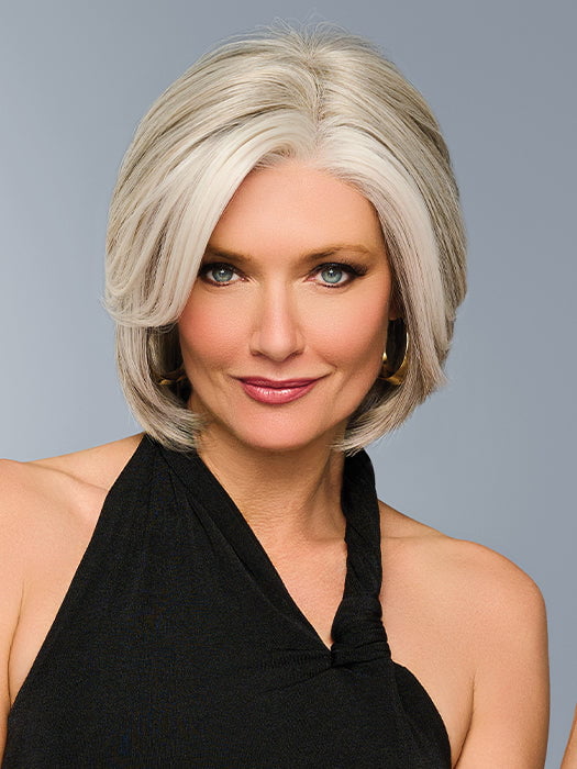 Model is wearing TAILORED ALLURE in color L51/61 ICED GRANITA | Lightest Grey Progresses to a Deep Grey at the Nape